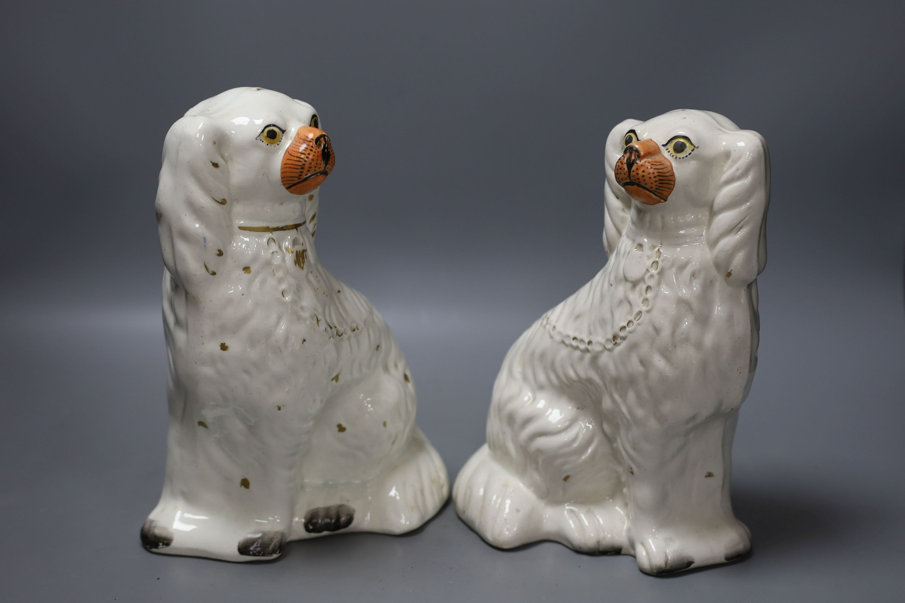 A pair of Staffordshire dogs, together with a pottery brush pot, Howell James mantle clock and other miscellaneous items including postal scales (7)